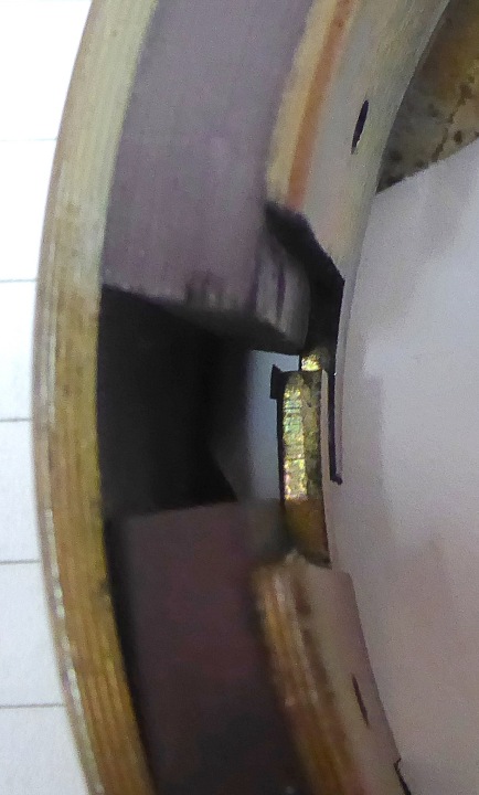 Sliver of steel attached to the underside of the more central ignition trigger point inside the rotor.